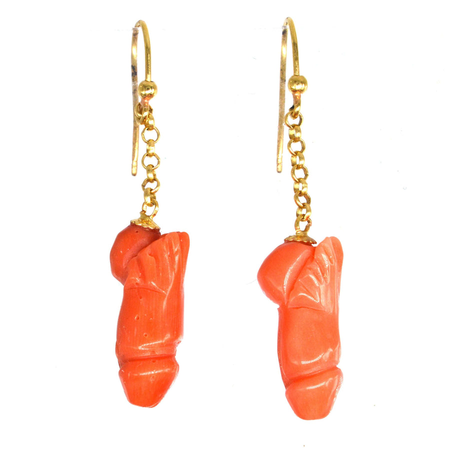 Vintage 18ct gold drop earrings featuring carved coral phallus design, symbolizing fertility and protection.