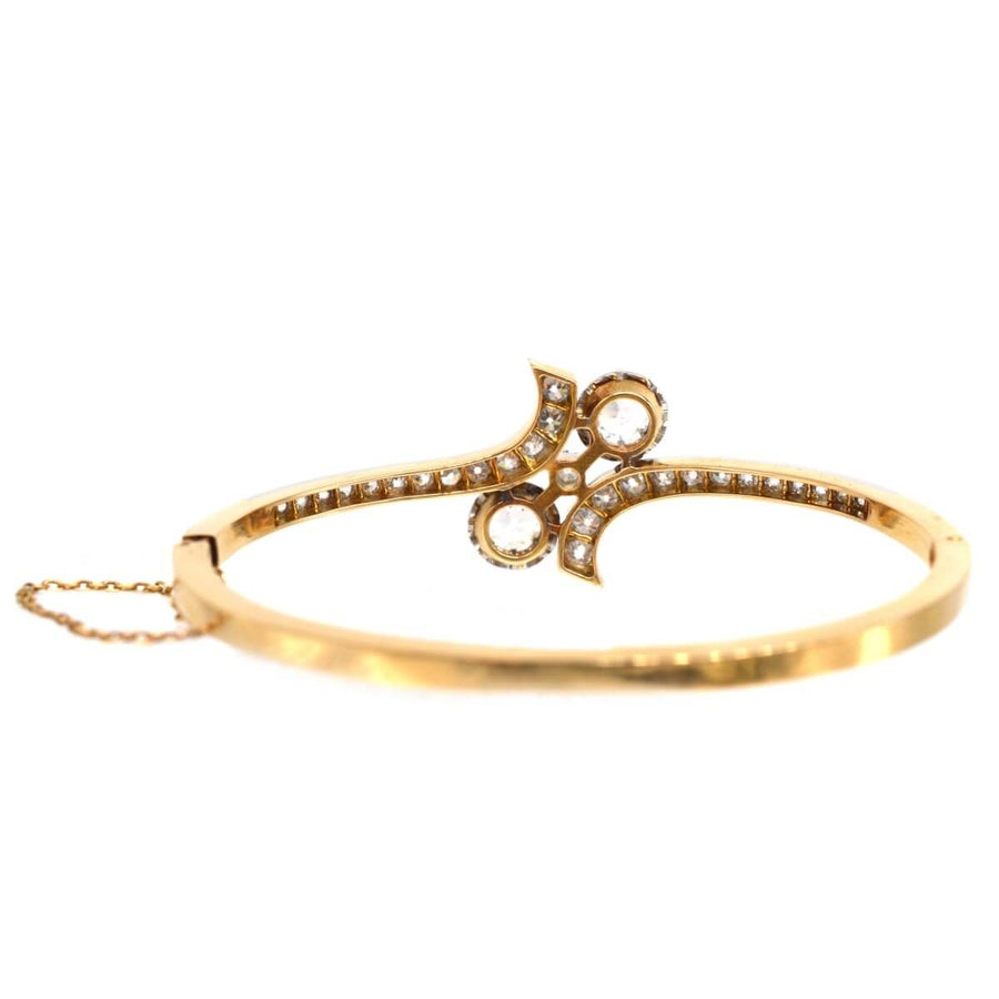 French 20th century 18ct gold and platinum Toi et Moi diamond bangle with intricate design and diamonds.