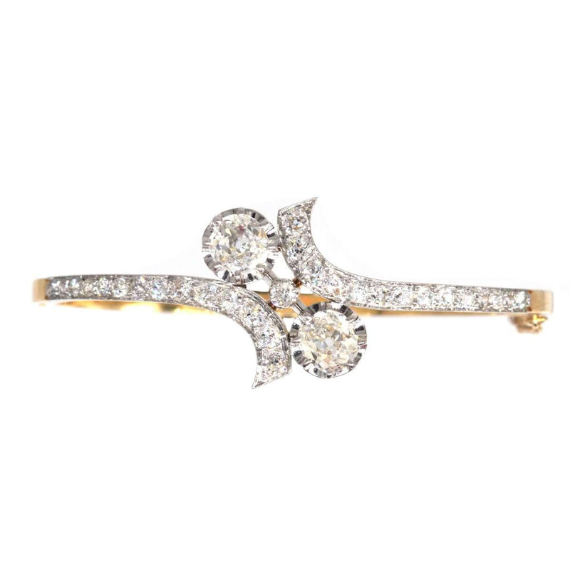 French Early 20th Century 18ct Gold and Platinum Toi et Moi Diamond Bangle