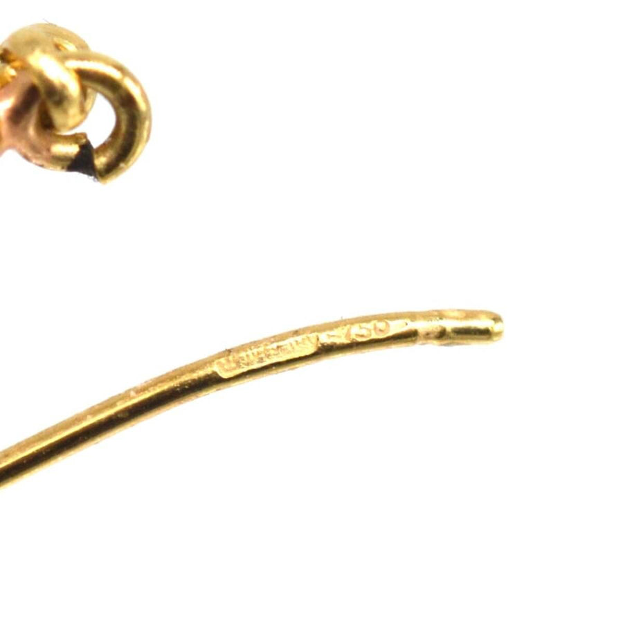 Close-up of the 18ct gold hook fitting from vintage coral drop earrings, showcasing craftsmanship and quality.