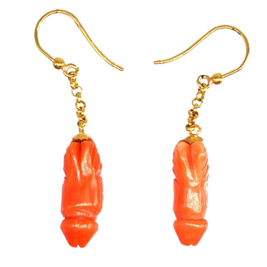 Vintage 18ct gold drop earrings featuring carved red coral phallus design for a unique statement piece.